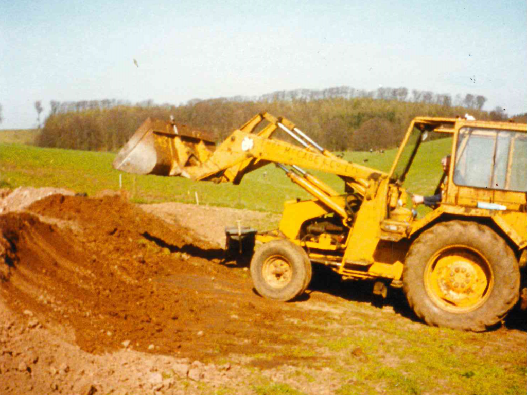 Roy Allan operating a digger at the original Brampton farm site, circa mid-1990s