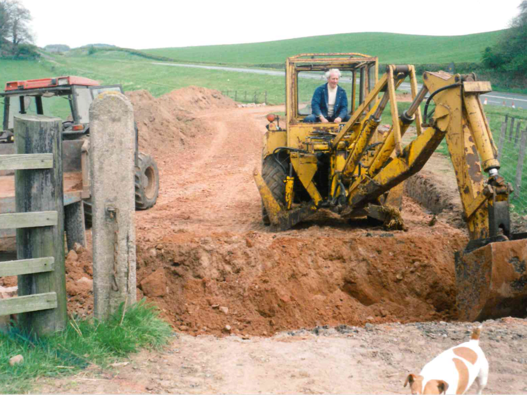 Roy Allan operating a digger at the original Brampton farm site, circa mid-1990s