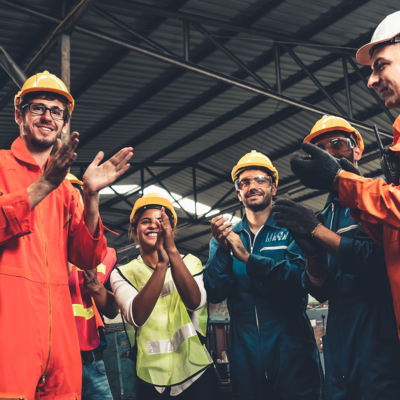 Workers in a warehouse applauding