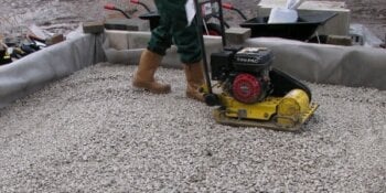 Sub base aggregate layer being compacted